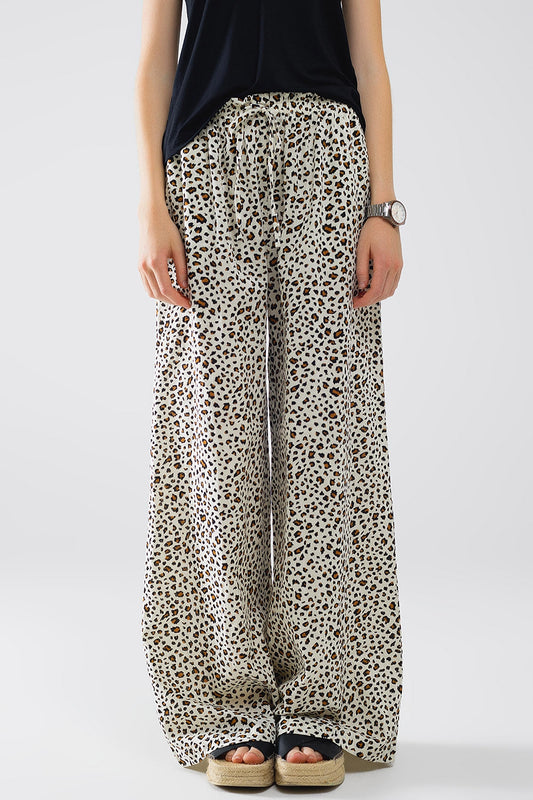 Pantalon décontractée, imprimé léopard, taille élastiquée, et cordon de serrage ajustable.